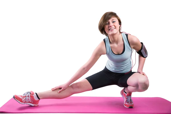 Brunette stretching her leg — Stock Photo, Image