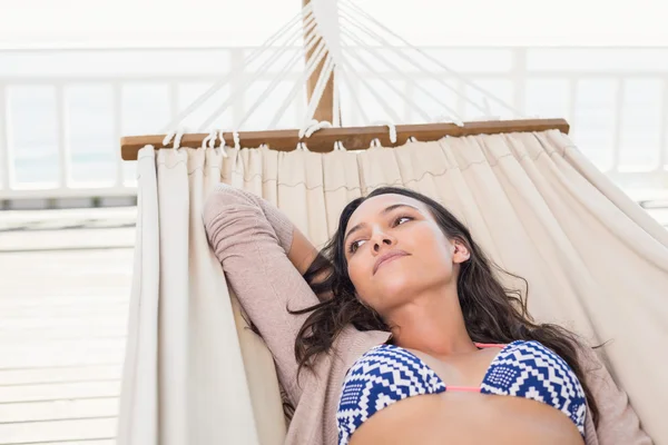 Pretty brunette relaxing on a hammock — Stock Photo, Image