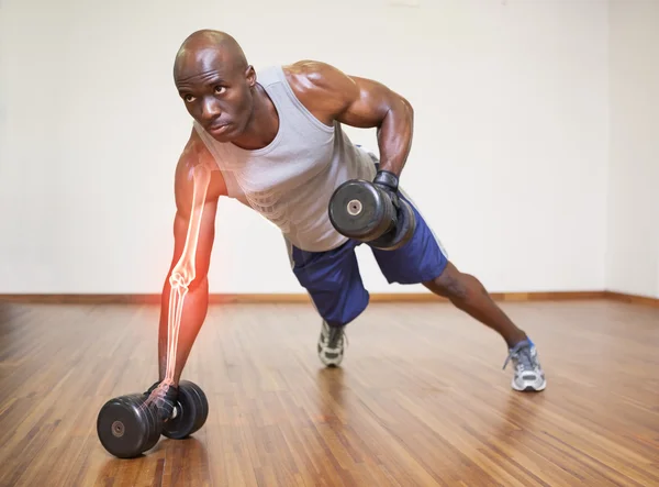 Strong man lifting weights — Stock Photo, Image