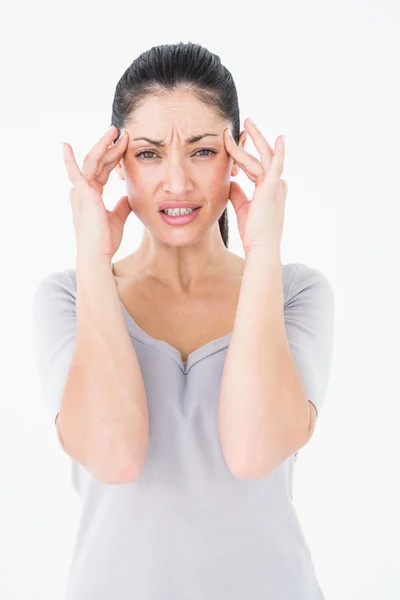 Brunette suffering from migraine — Stock Photo, Image