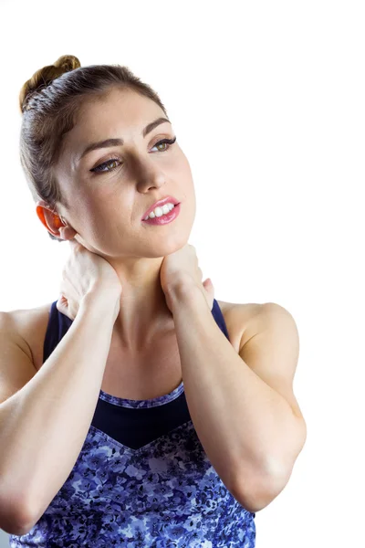 Fit brunette woman with neck injury — Stock Photo, Image