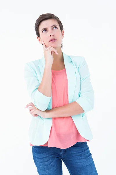 Thoughtful woman with finger on cheek — Stock Photo, Image