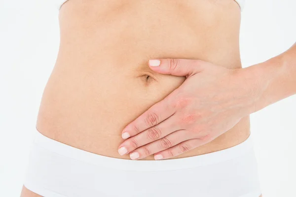 Woman touching her painful stomach — Stock Photo, Image