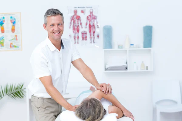 Physiotherapist doing back massage to his patient — Stock Photo, Image