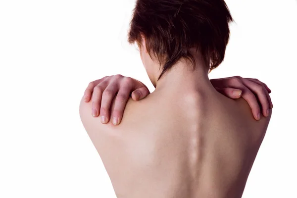 Nude woman with a shoulder injury — Stock Photo, Image