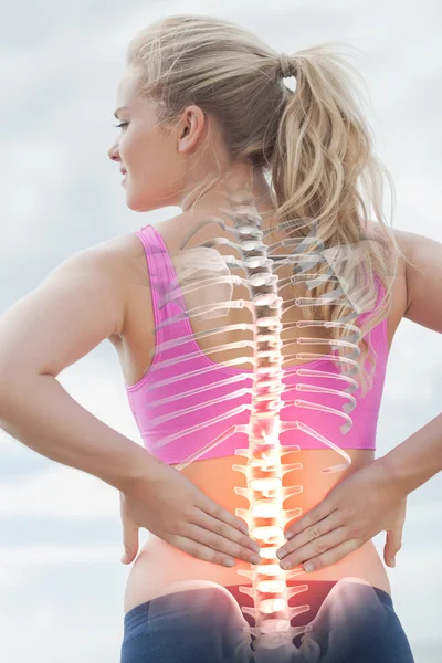 Highlighted spine of woman with back pain — Stock Photo, Image