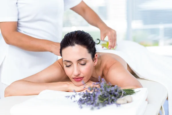 Smiling woman getting an aromatherapy treatment — Stock Photo, Image