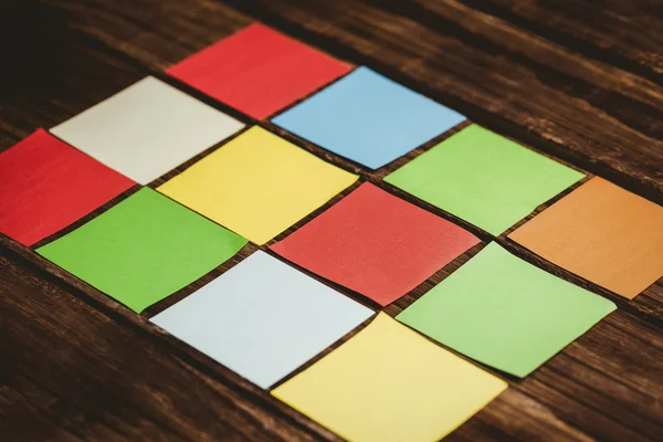 Colorful sticky post its on wooden background — Stock Photo, Image