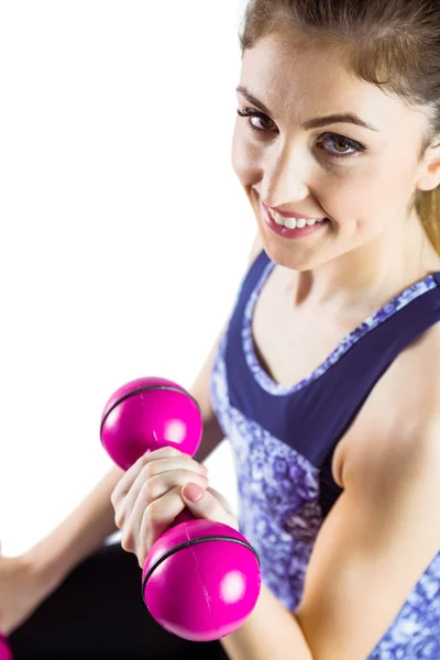 Fit woman lifting dumbbell — Stock Photo, Image