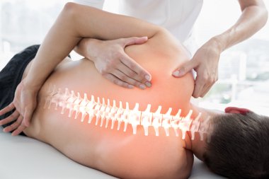 Highlighted bones of man at physiotherapy clipart