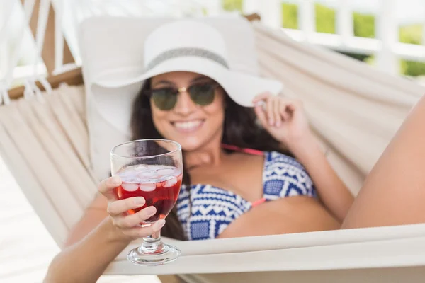 Pretty brunette drinking cocktail — Stock Photo, Image