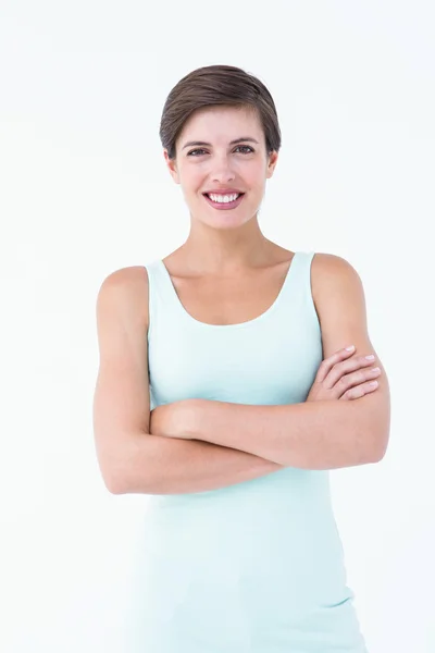 Mujer morena feliz con los brazos cruzados —  Fotos de Stock