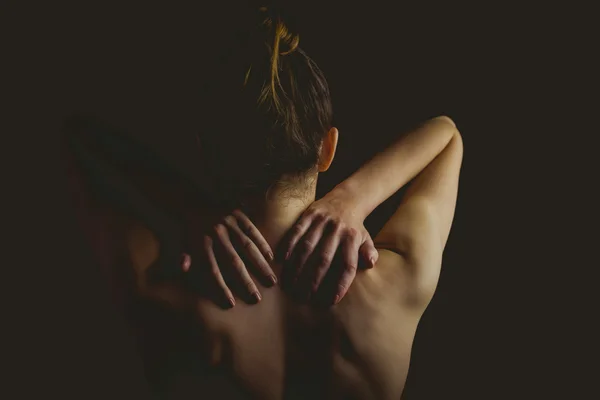 Nude woman with a neck injury — Stock Photo, Image
