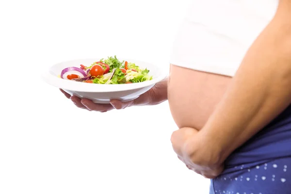 Mulher grávida comendo uma salada — Fotografia de Stock