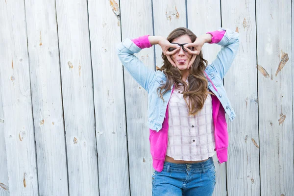 Pretty woman looking thought fingers — Stock Photo, Image