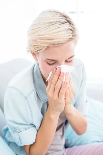 Sick woman blowing her nose — Stock Photo, Image