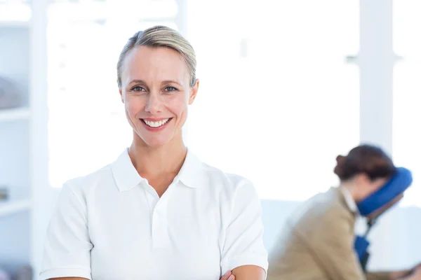 Physiotherapist with arms crossed — Stock Photo, Image