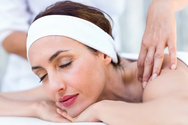 Beautiful brunette having back massage — Stock Photo, Image