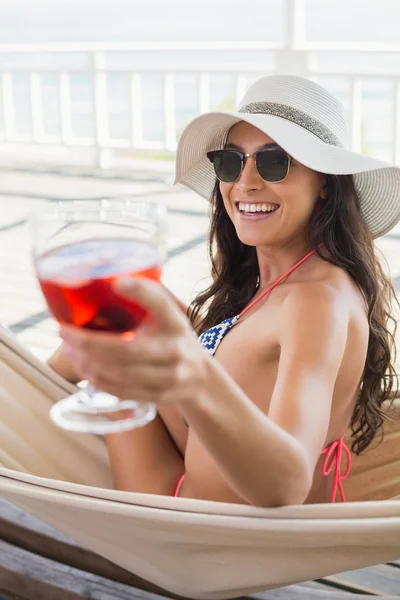 Pretty brunette drinking cocktail — Stock Photo, Image