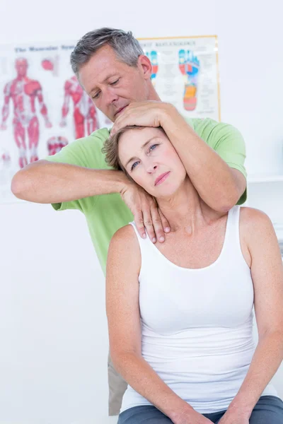 Doctor doing neck adjustment — Stock Photo, Image