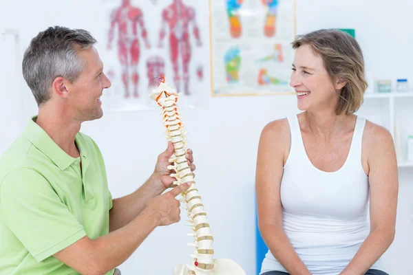 Doctor showing anatomical spine — Stock Photo, Image