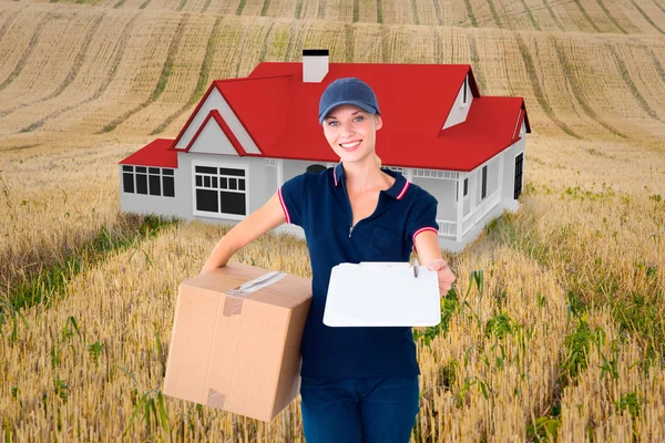 Happy delivery woman holding cardboard box — Stock Photo, Image