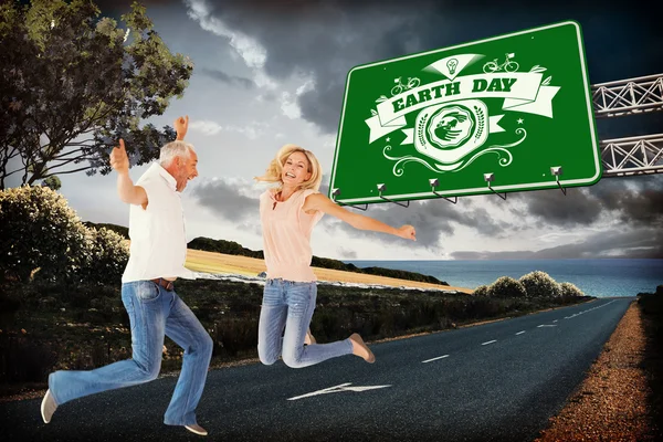 Excited couple cheering and jumping — Stock Photo, Image