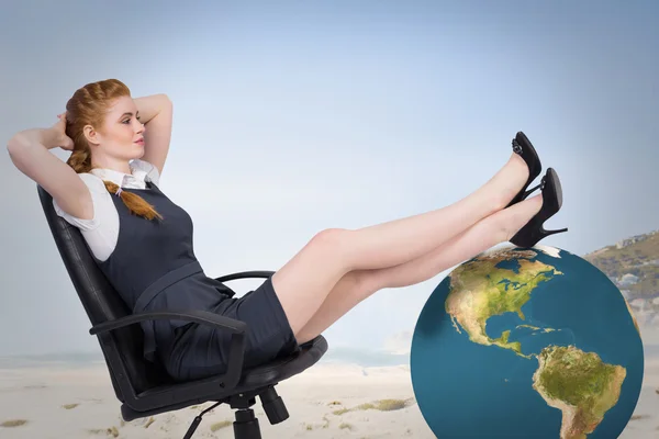 Businesswoman sitting on swivel chair — Stock Photo, Image