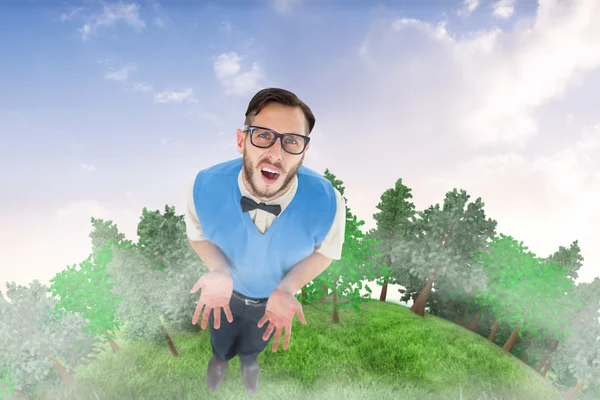 Geeky hipster looking confused against sky — Stock Photo, Image