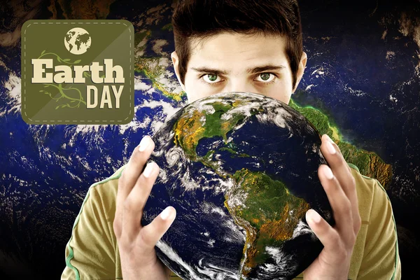 Earth day graphic against man holding earth — Stok fotoğraf