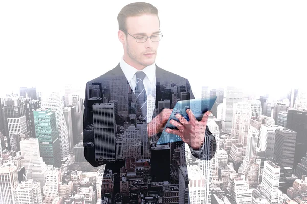 Unsmiling businessman using tablet pc — Stock Photo, Image