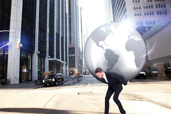 Businessman carrying the world — Stock Photo, Image