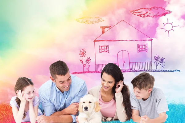 Family looking at puppy — Stock Photo, Image