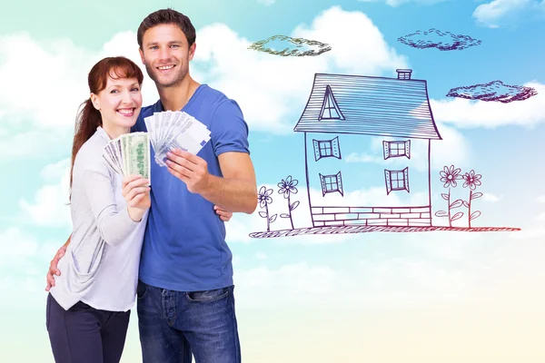 Couple holding fans of cash — Stock Photo, Image