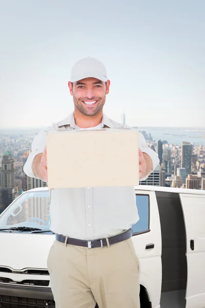 Portrait of happy delivery man giving package — Stock Photo, Image