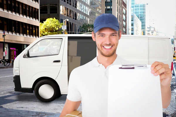 Delivery man holding cardboard box — Stock Photo, Image