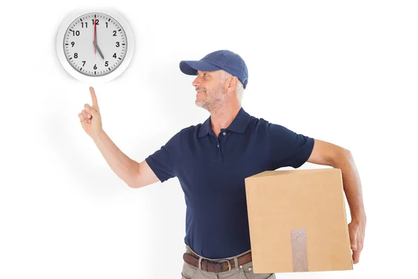 Delivery man holding cardboard box — Stock Photo, Image