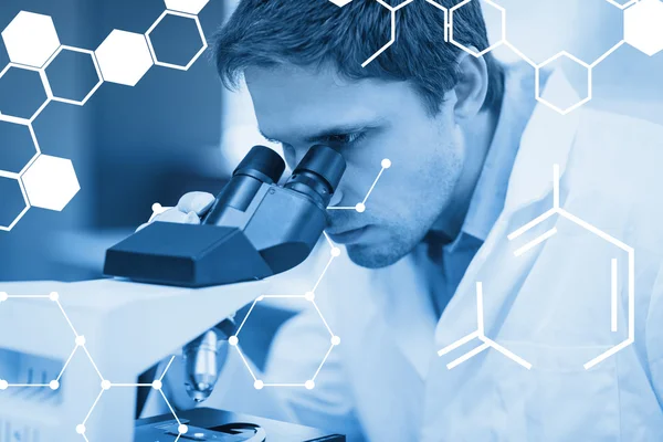 Scientific researcher using microscope — Stock Photo, Image