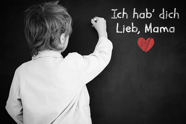 Composite image of schoolchild with blackboard — Stock Photo, Image