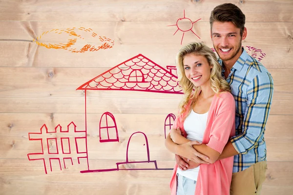 Imagen compuesta de atractiva pareja joven sonriendo a la cámara — Foto de Stock