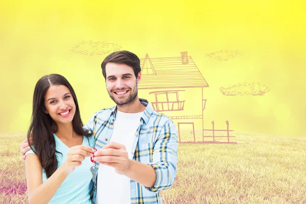 Couple showing new house key — Stock Photo, Image