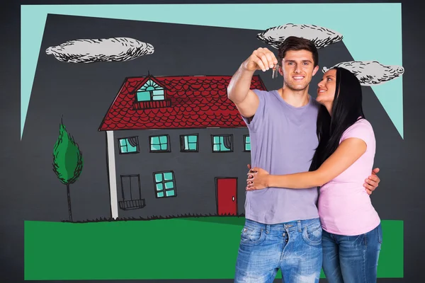 Couple showing keys to house — Stock Photo, Image