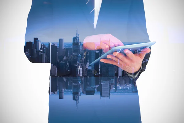 Samengestelde afbeelding van zakenman raken zijn tablet pc — Stockfoto