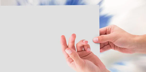 Composite image of hand showing card — Stock Photo, Image