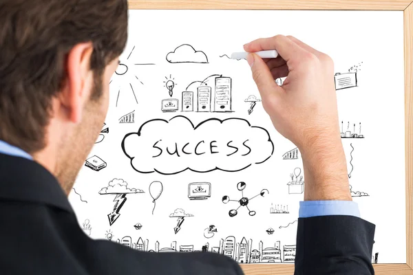 Businessman writing with a white chalk — Stock Photo, Image