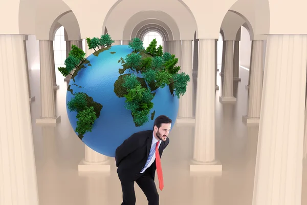 Businessman carrying the world — Stock Photo, Image