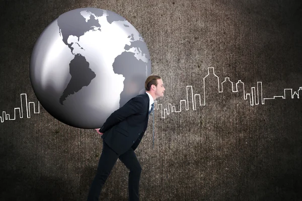 Businessman carrying the world — Stock Photo, Image