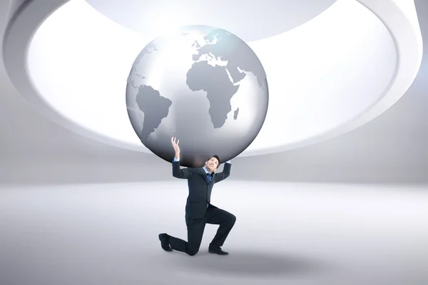 Businessman carrying the world — Stock Photo, Image