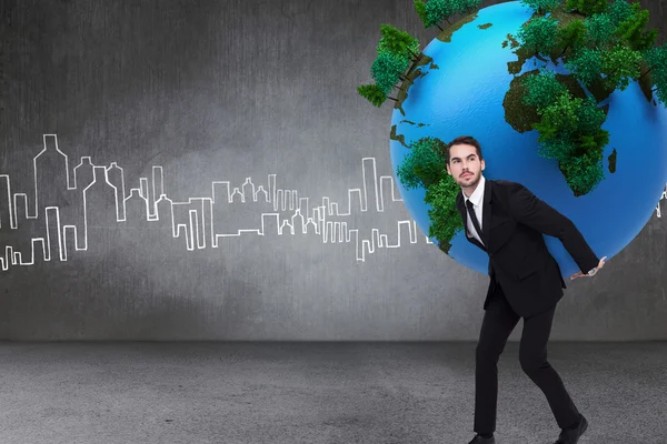 Businessman carrying the world — Stock Photo, Image