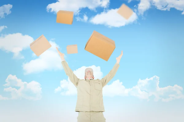 Delivery man with arms raised — Stock Photo, Image